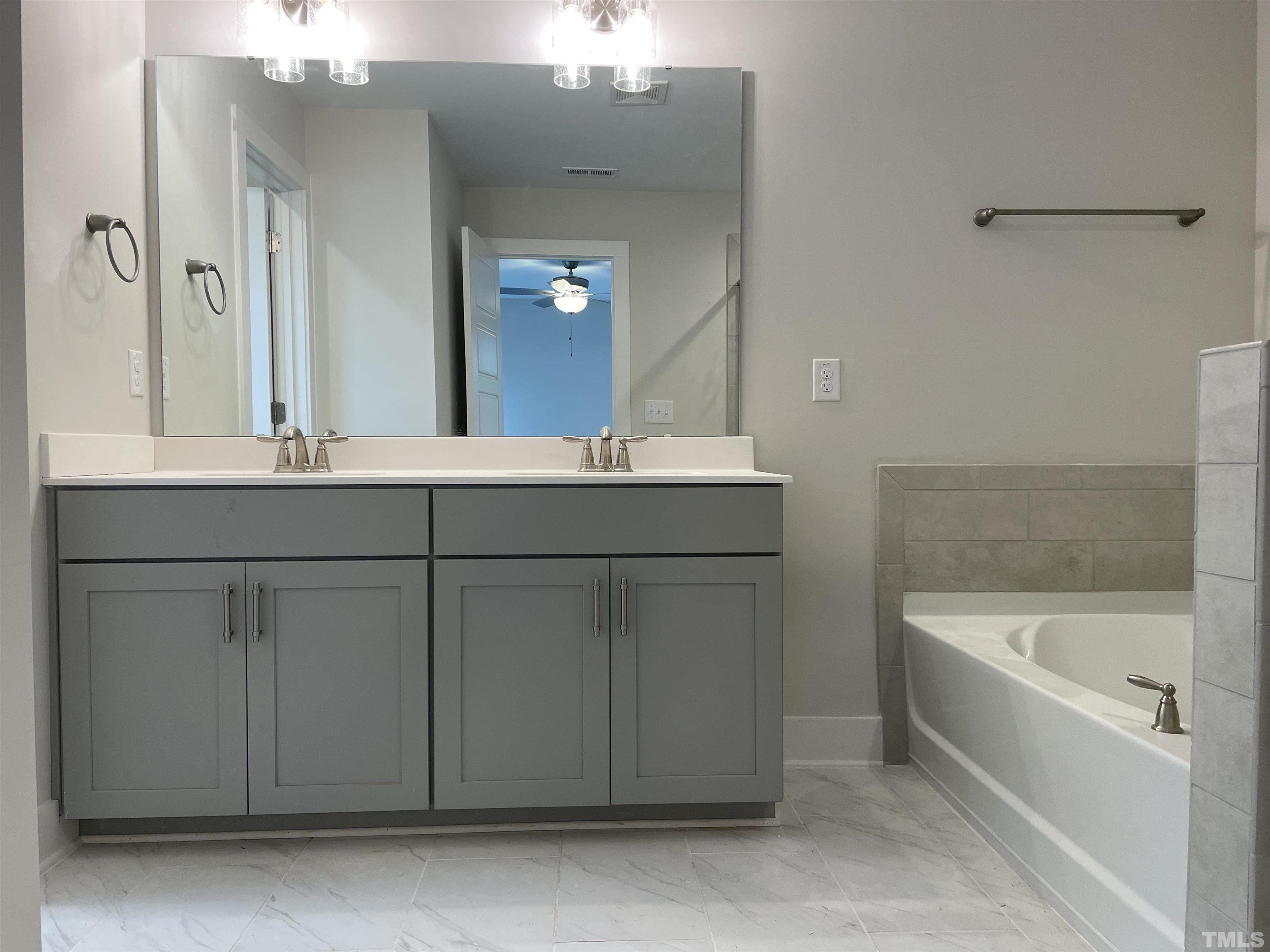 1308 B Castlebay Road Durham, NC 27704 - Photo 19 of 25 a bathroom with a sink and a bathtub