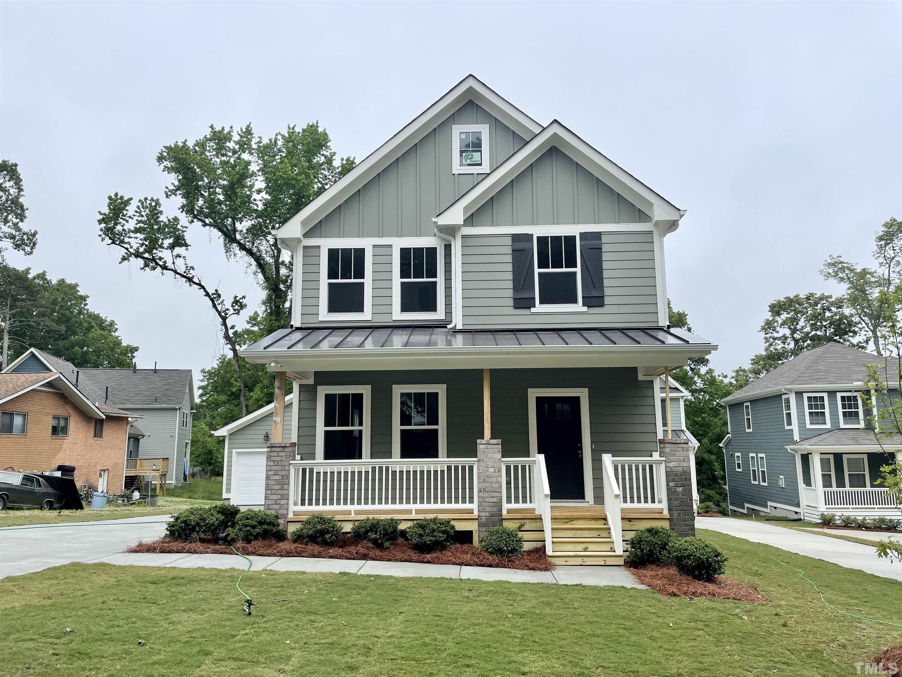 1308 B Castlebay Road Durham, NC 27704 - Photo 2 of 25 a front view of a house with a yard