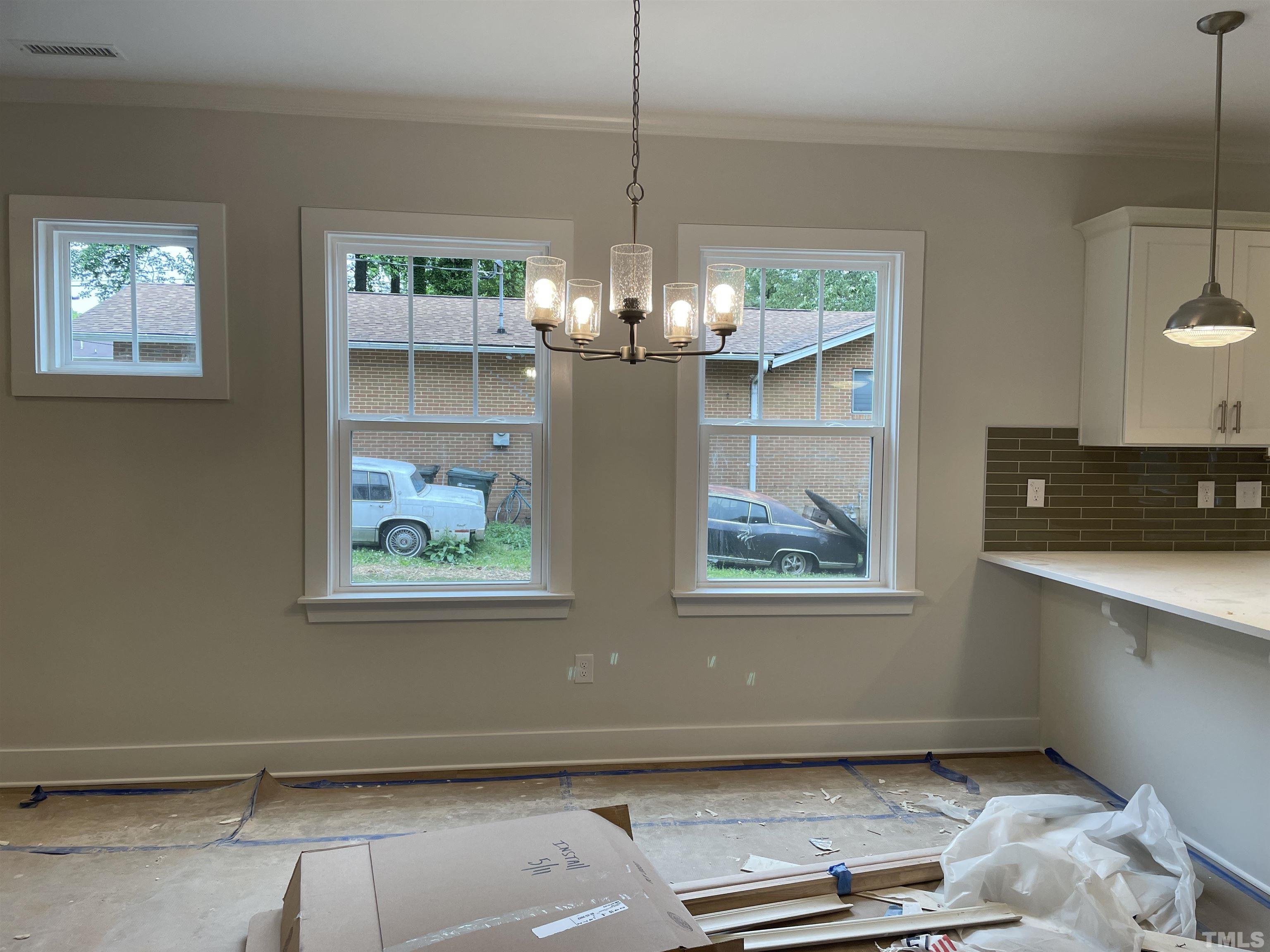 1308 B Castlebay Road Durham, NC 27704 - Photo 6 of 25 a view of a room with window and wooden floor