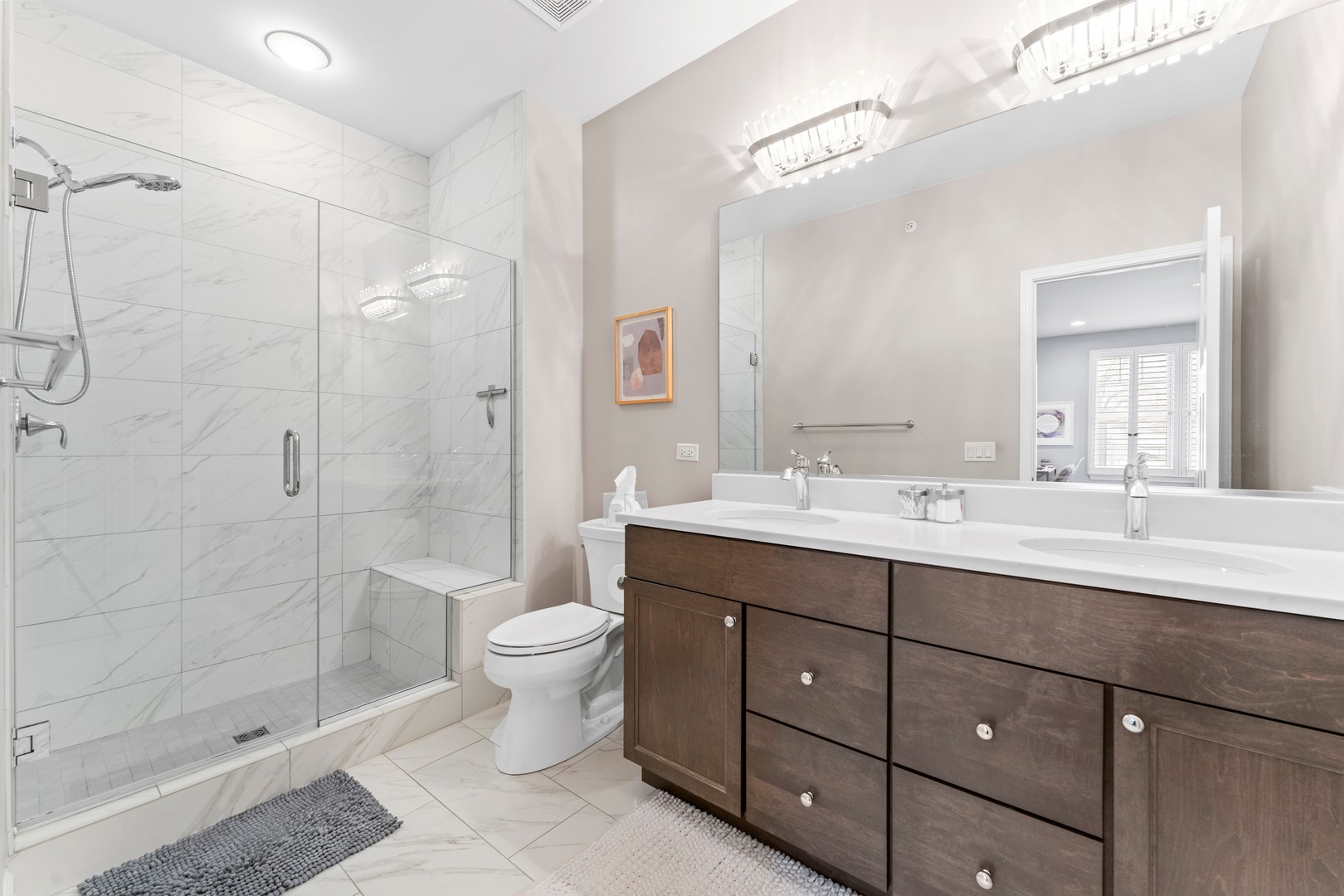 826 Chestnut Street Deerfield, IL 60015 - Photo 14 of 28 a bathroom with a double vanity sink toilet and shower