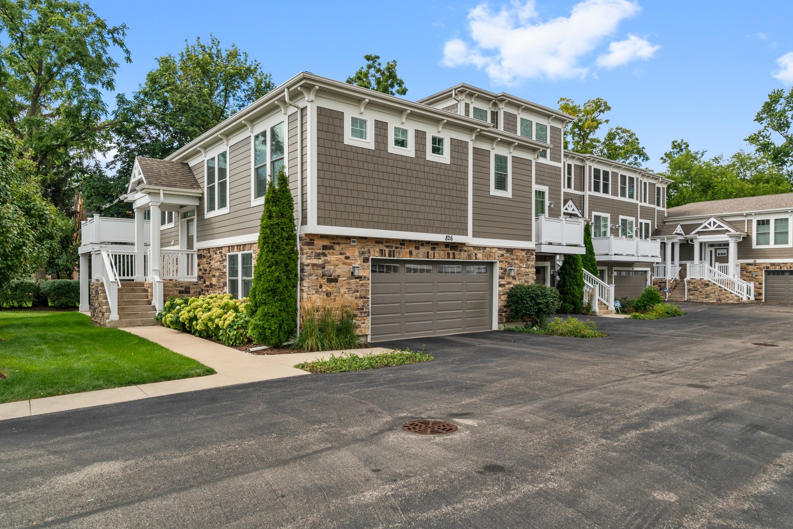 826 Chestnut Street Deerfield, IL 60015 - Photo 22 of 28 a front view of a house with a yard and garage