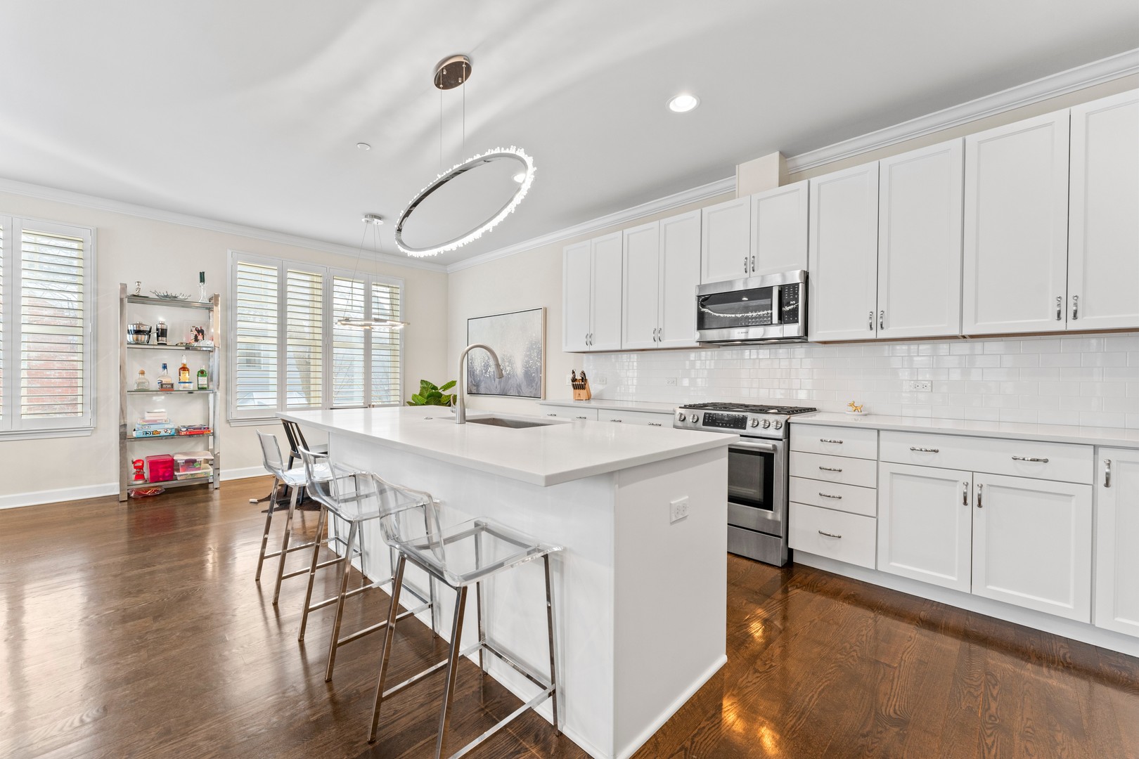 826 Chestnut Street Deerfield, IL 60015 - Photo 4 of 28 a kitchen with stainless steel appliances white cabinets and wooden floor