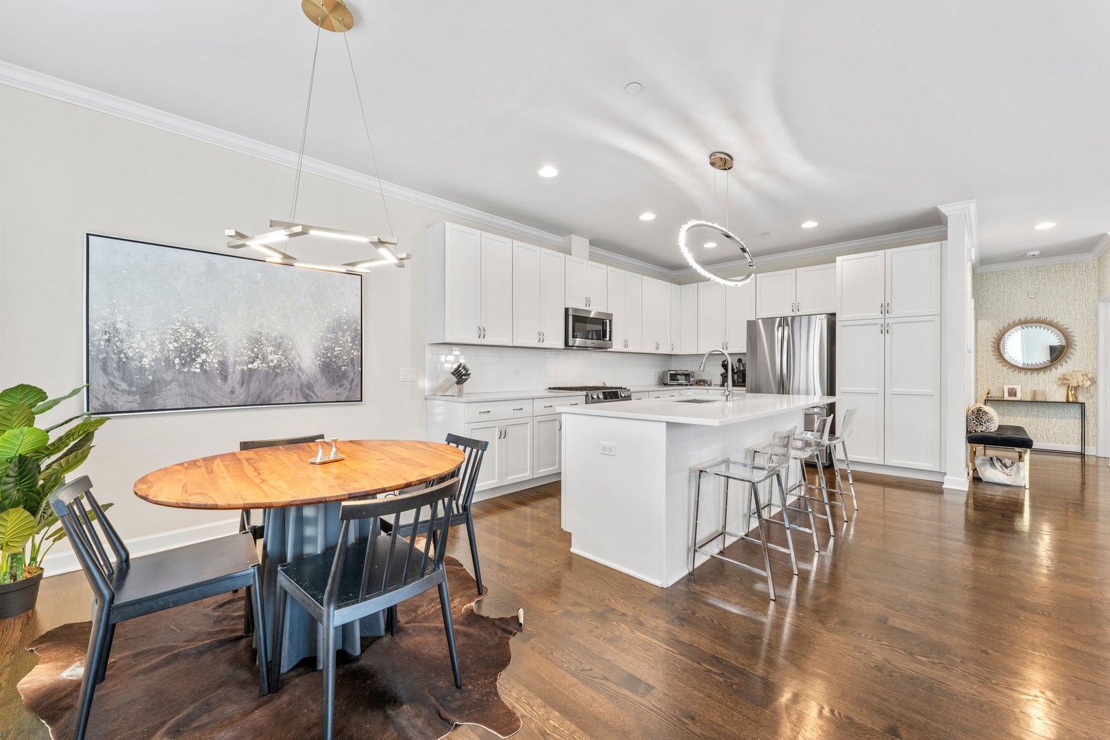 826 Chestnut Street Deerfield, IL 60015 - Photo 7 of 28 a kitchen with stainless steel appliances kitchen island granite countertop a dining table chairs and white cabinets
