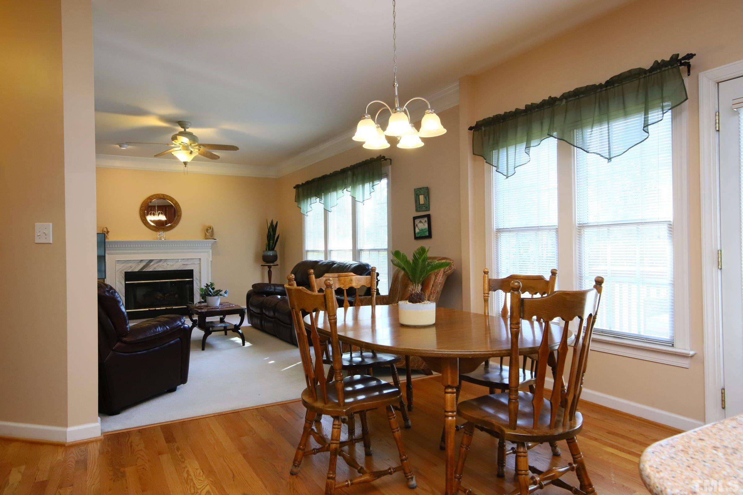 3307 Meadowrun Drive Durham, NC 27707 - Photo 18 of 29 a view of a dining room with furniture window and wooden floor