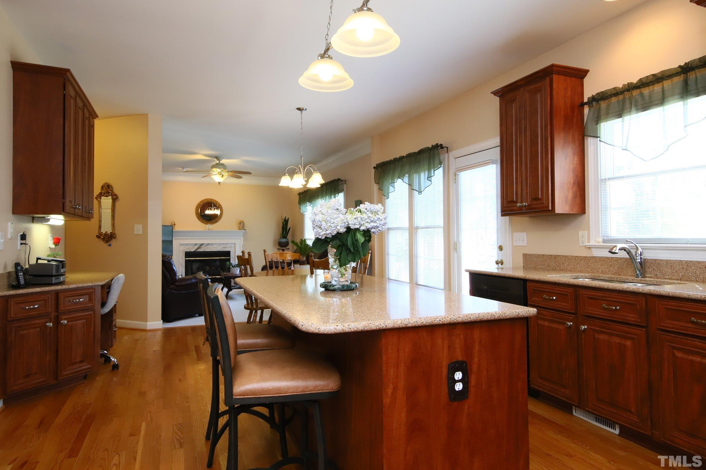 3307 Meadowrun Drive Durham, NC 27707 - Photo 21 of 29 a view of a dining room with furniture and a chandelier
