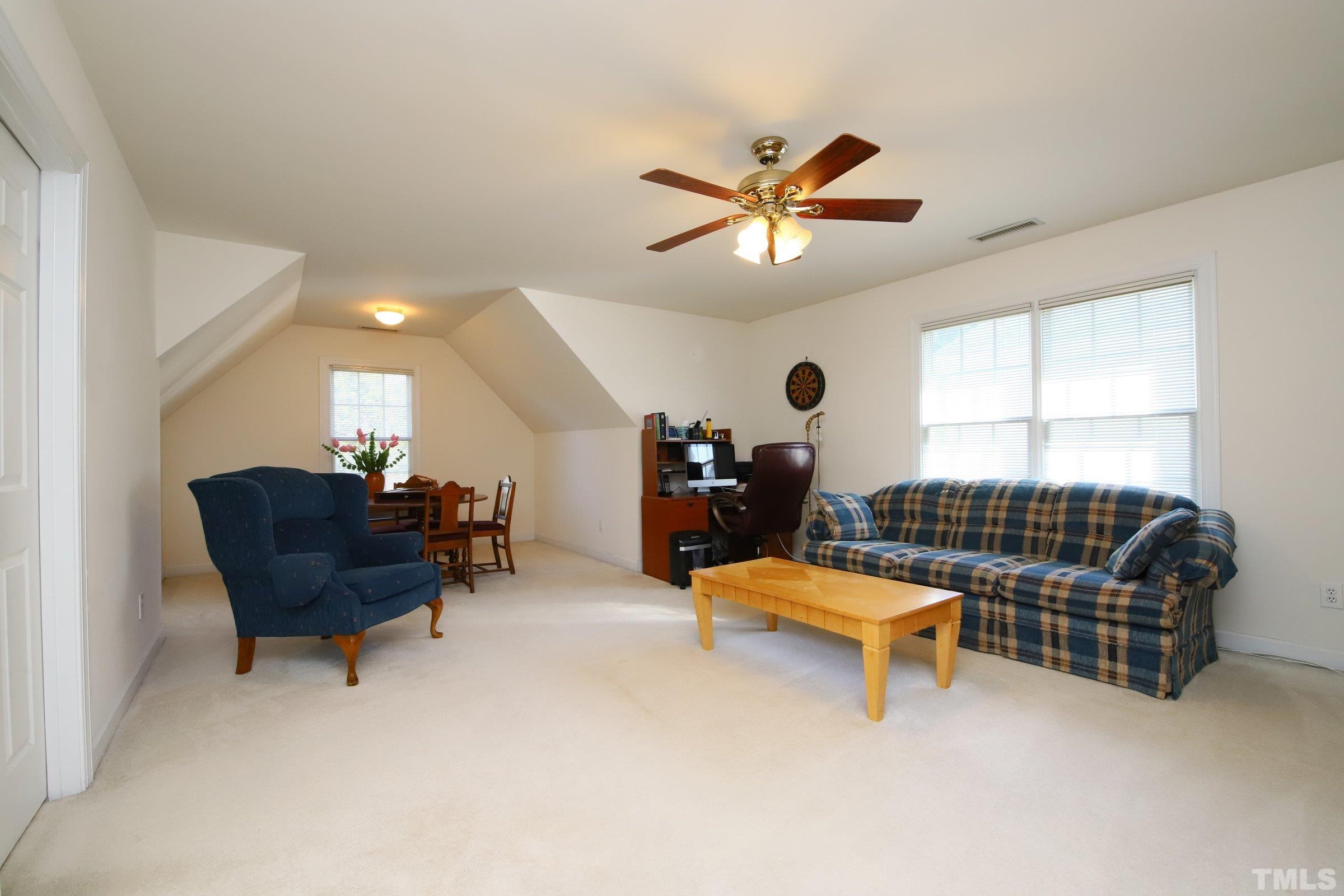 3307 Meadowrun Drive Durham, NC 27707 - Photo 26 of 29 a living room with furniture and a window