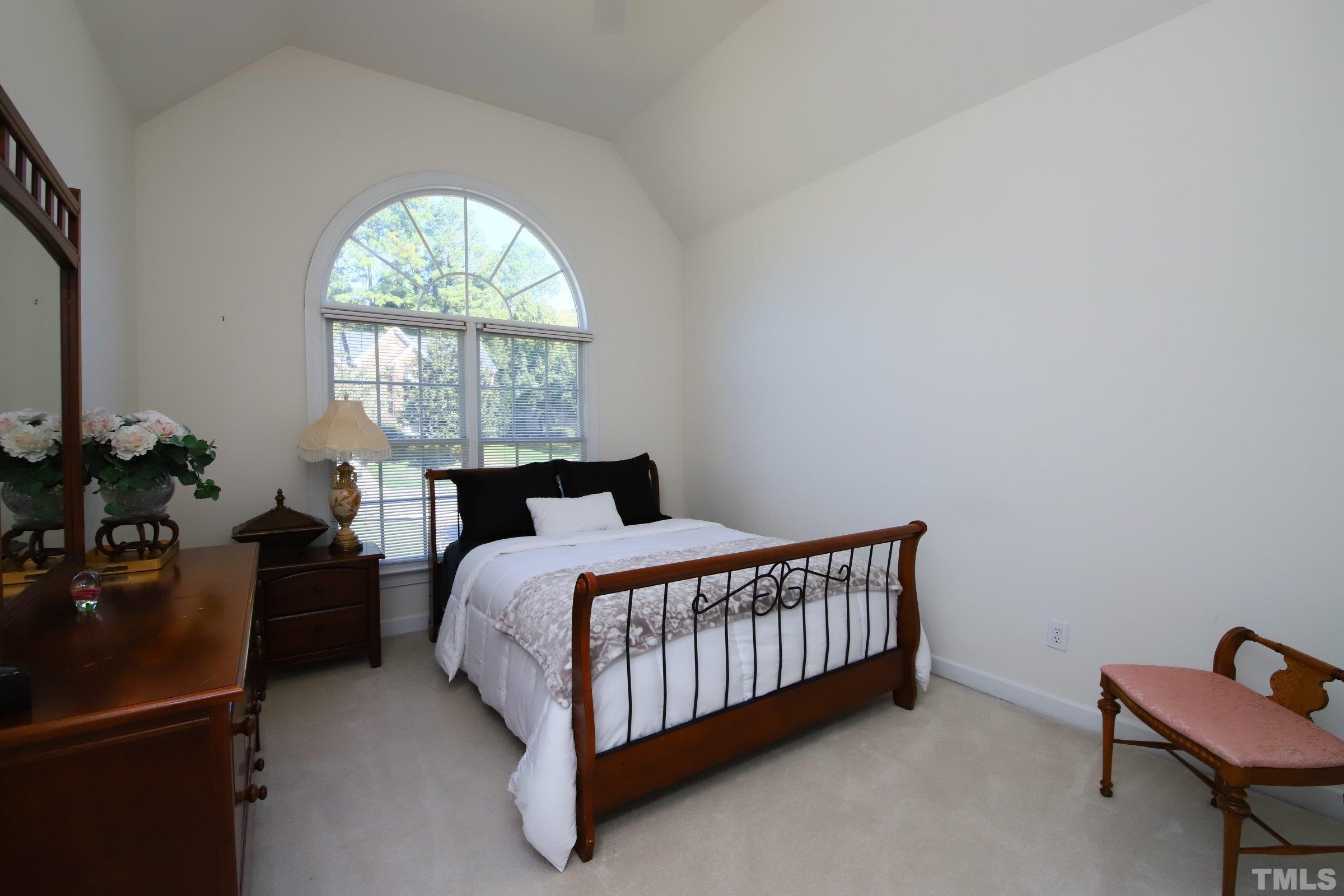 3307 Meadowrun Drive Durham, NC 27707 - Photo 27 of 29 a bedroom with a bed and a window