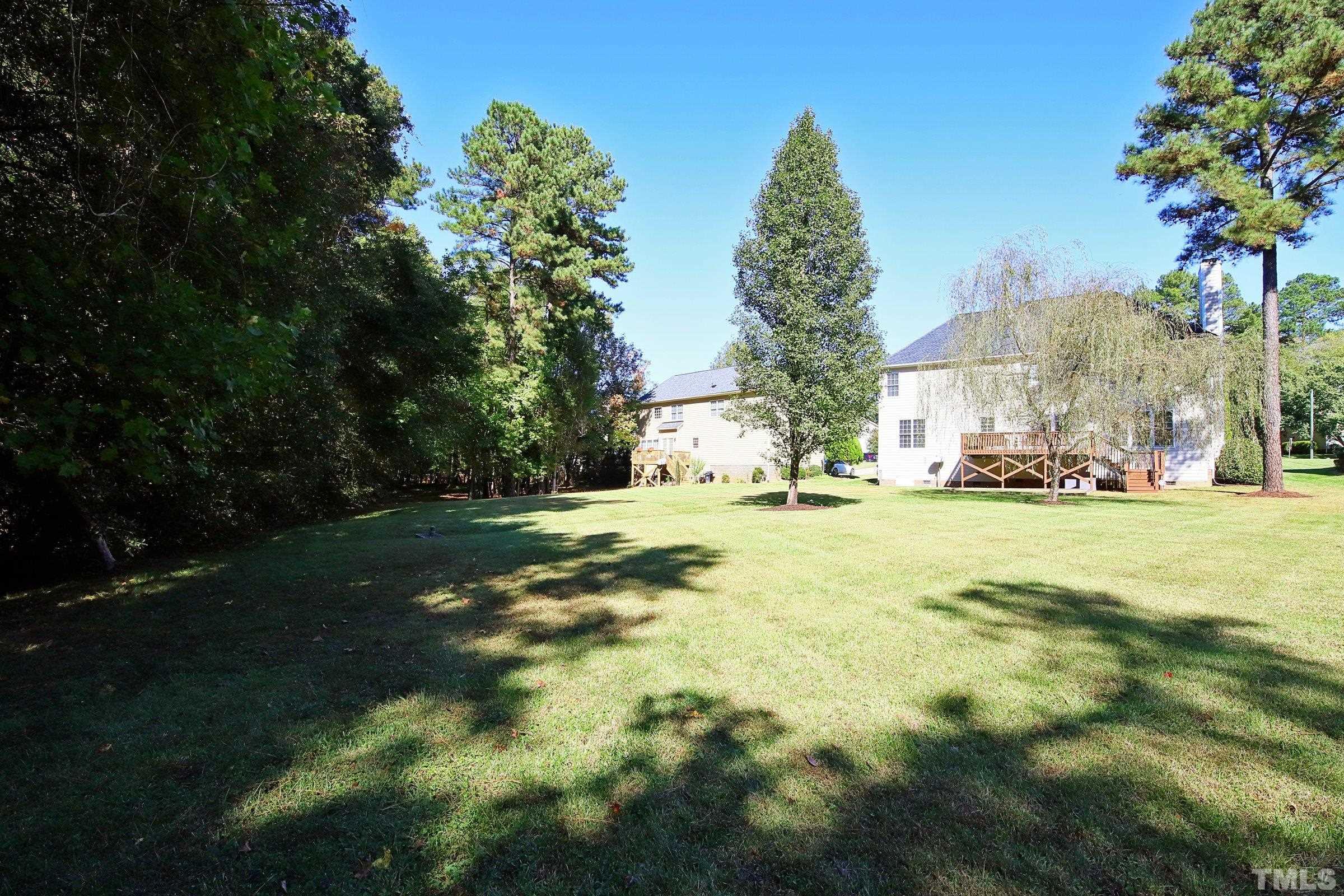 3307 Meadowrun Drive Durham, NC 27707 - Photo 4 of 29 a view of yard with residential houses and trees