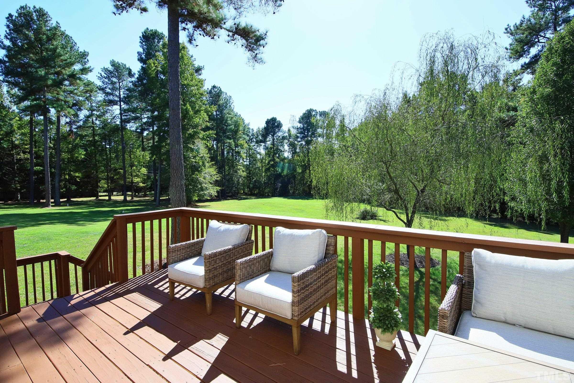 3307 Meadowrun Drive Durham, NC 27707 - Photo 8 of 29 a view of a two chairs in the deck