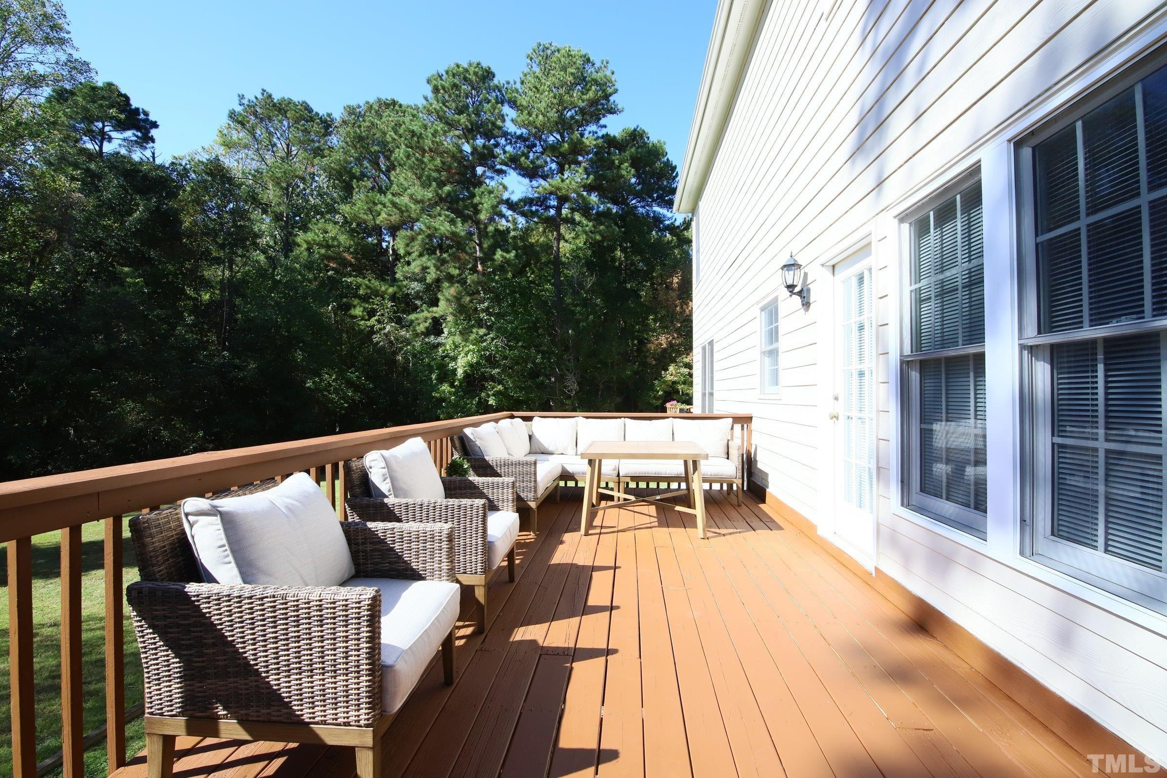 3307 Meadowrun Drive Durham, NC 27707 - Photo 9 of 29 a balcony with wooden floor and outdoor seating