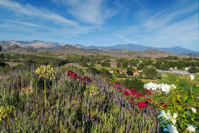 an aerial view of residential house with outdoor space and swimming pool