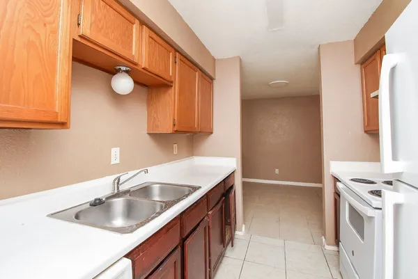 a kitchen with a sink and cabinets