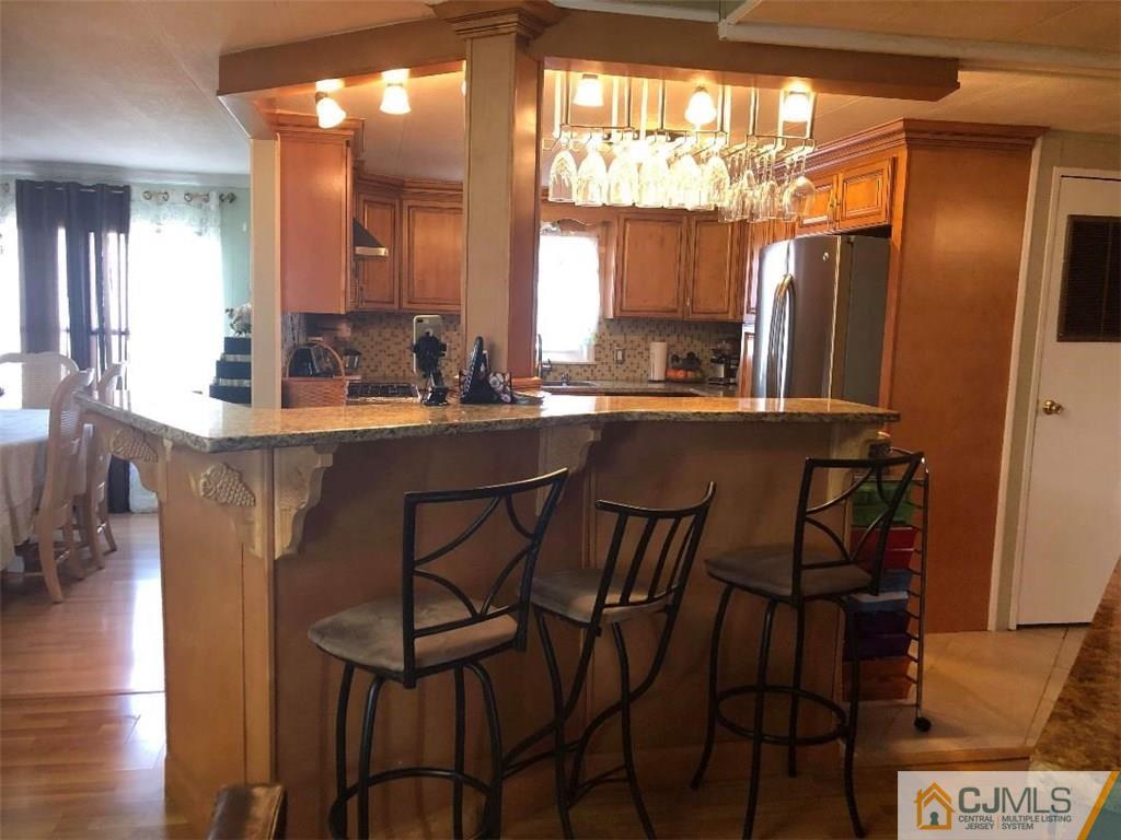 6 Poe Road, Unit 6 North Brunswick, NJ 08902 - Photo 8 of 22 a dining room with furniture and window
