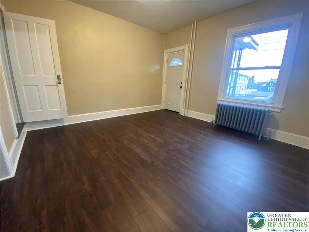 122 South Spruce Street Nazareth, PA 18064 - Photo 5 of 11 an empty room with wooden floor and windows