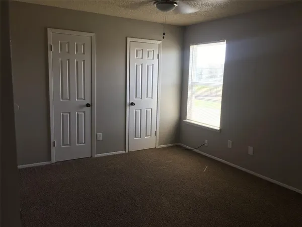 an empty room that has a window in it