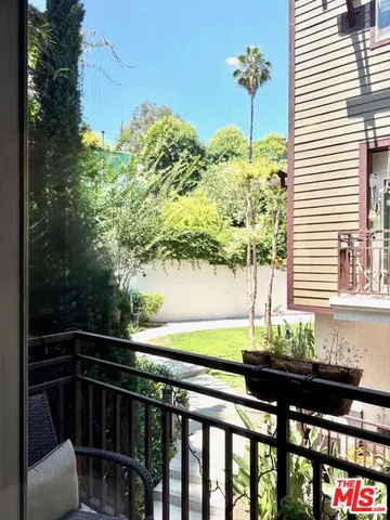 a view of a balcony with chairs