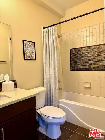 a bathroom with a sink a toilet and a bathtub