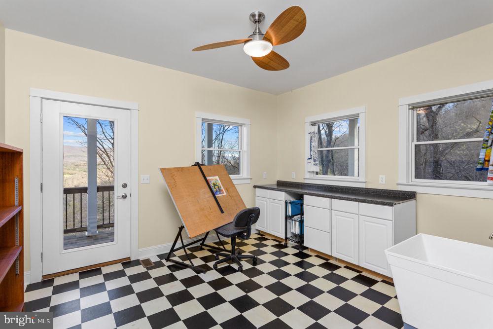 9586 Brunk Spring Lane Broadway, VA 22815 - Photo 16 of 57 a spacious bedroom with a bed and a window