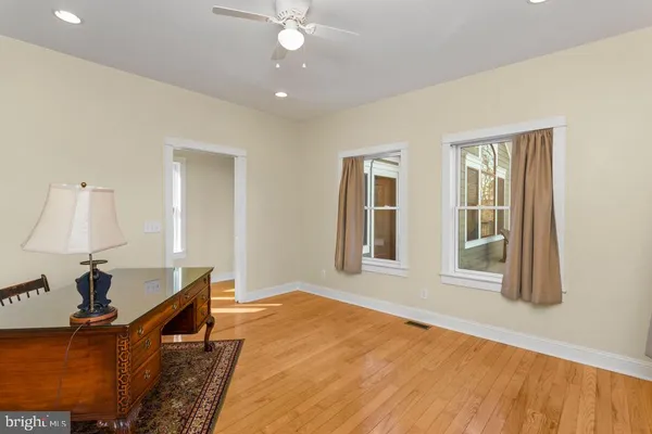 a spacious bedroom with a bed and a window