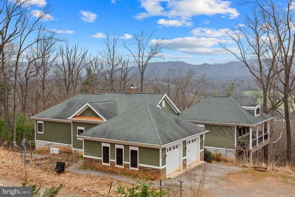 a aerial view of a house with a yard