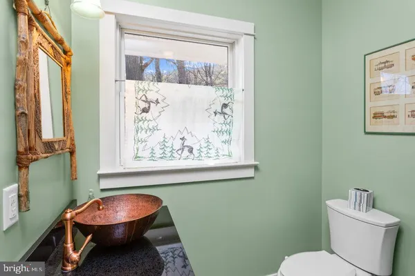 a bathroom with a toilet and a sink