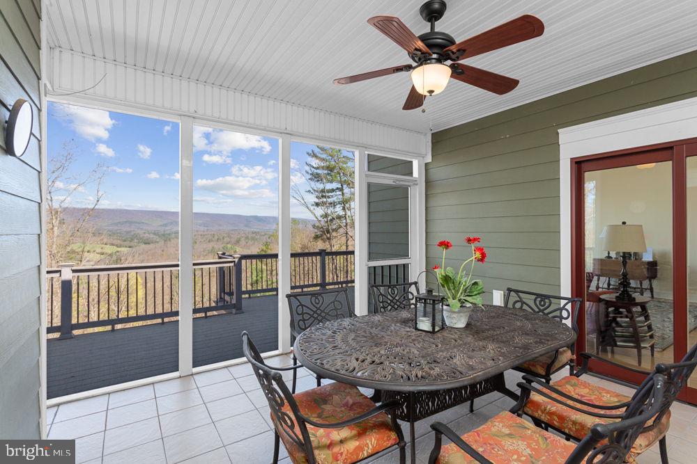 9586 Brunk Spring Lane Broadway, VA 22815 - Photo 23 of 57 a view of a dining room with furniture window and outside view