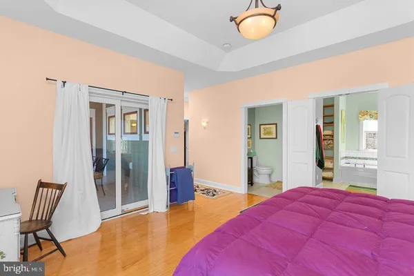 a bedroom with a bed and chair