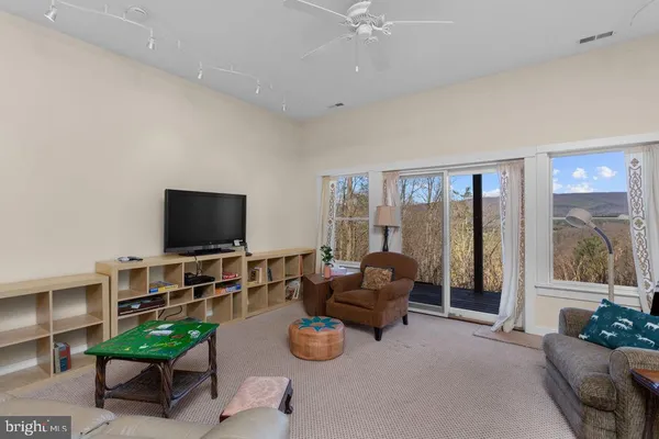 a reading room with furniture and a book shelf
