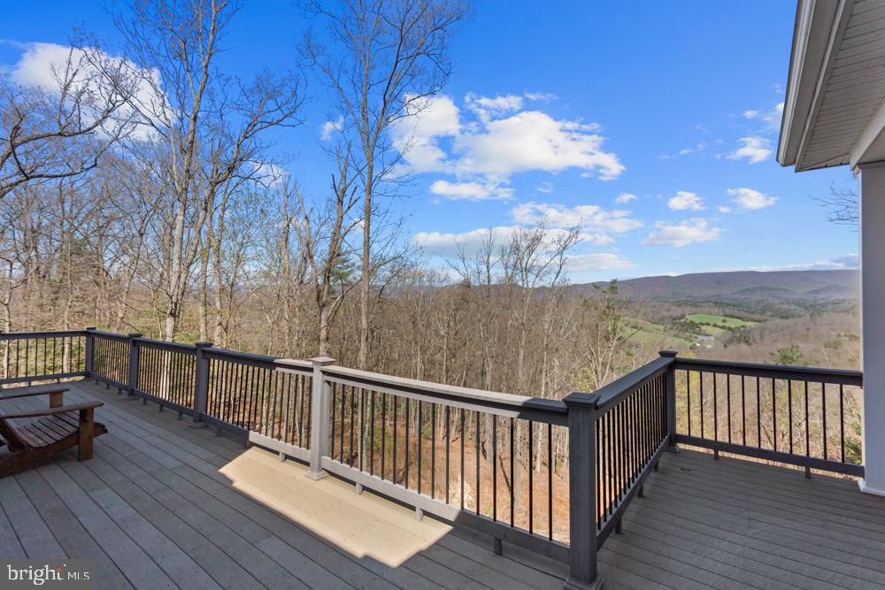 9586 Brunk Spring Lane Broadway, VA 22815 - Photo 44 of 57 a view of a balcony with wooden floor and fence