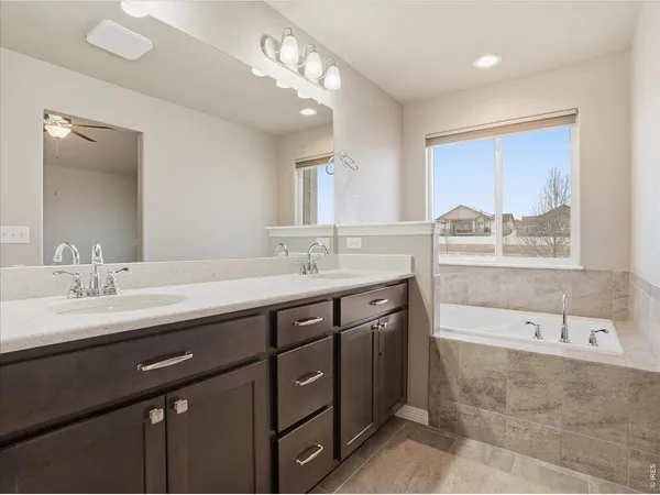 a bathroom with a shower and a sink