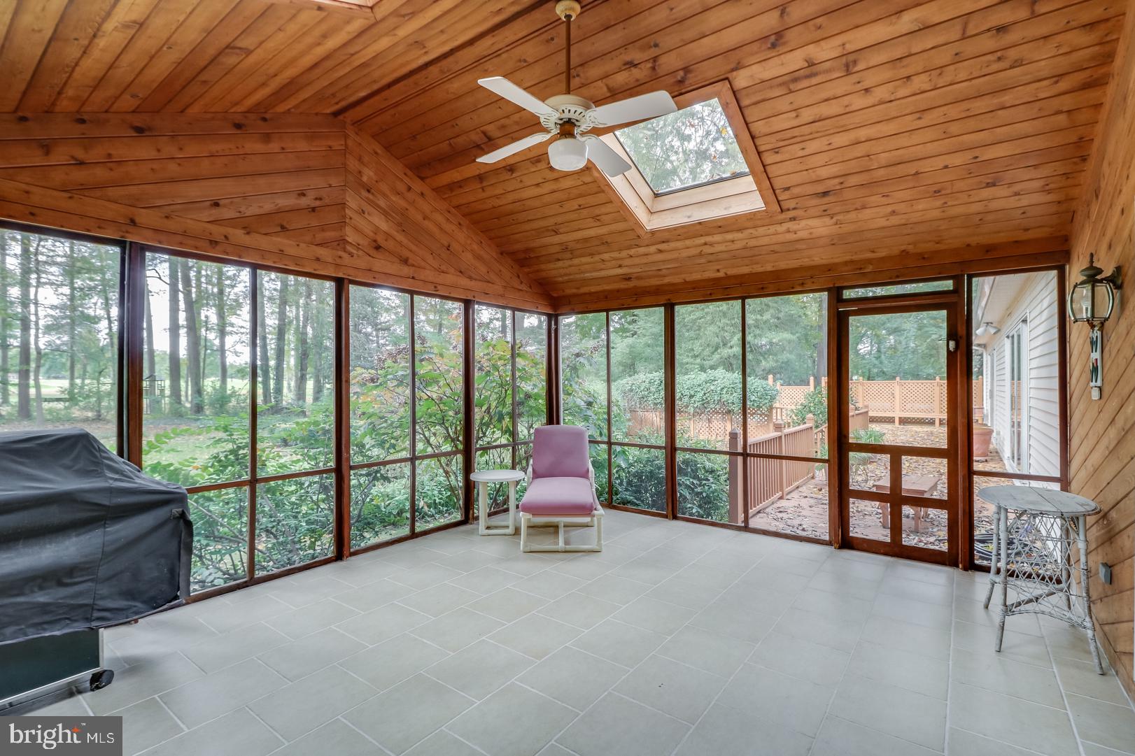 515 Troon Road Dover, DE 19904 - Photo 28 of 33 Screened porch that leads to deck and hot tub.