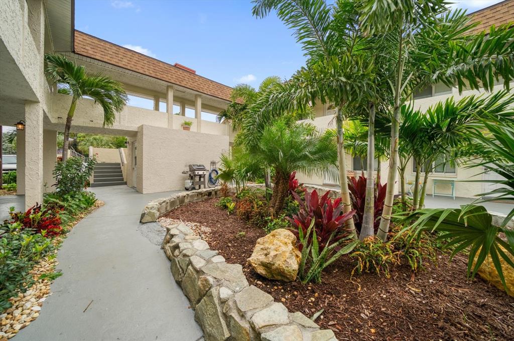 2704 2nd Street, Unit 16 Indian Rocks Beach, FL 33785 - Photo 4 of 23 a view of outdoor space yard and porch