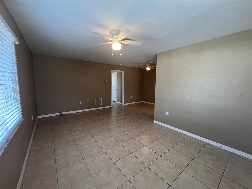 2704 2nd Street, Unit 16 Indian Rocks Beach, FL 33785 - Photo 8 of 23 a view of an empty room with a window