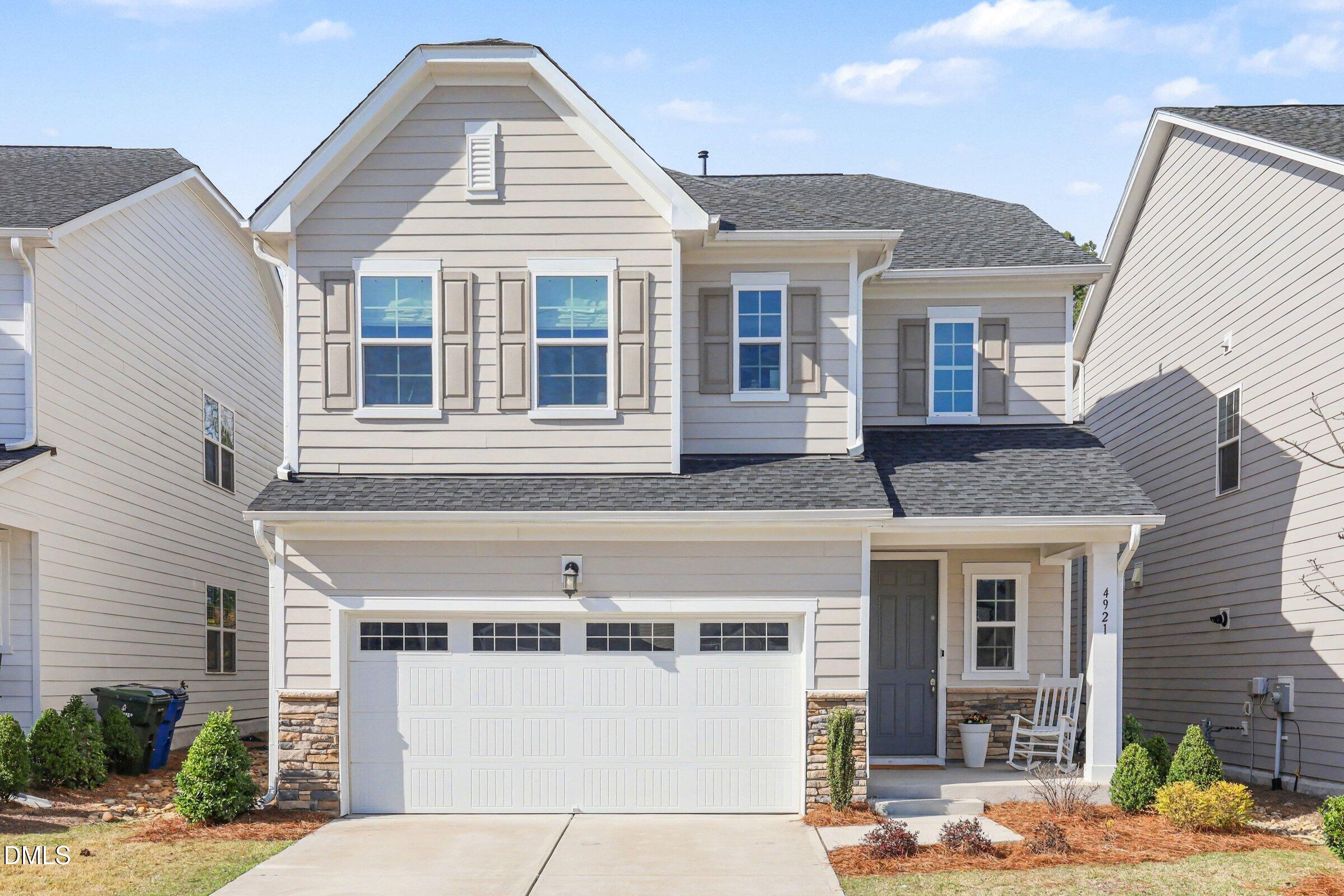 4921 Abundance Avenue Raleigh, NC 27616 - Photo 1 of 36 a front view of a house with a yard