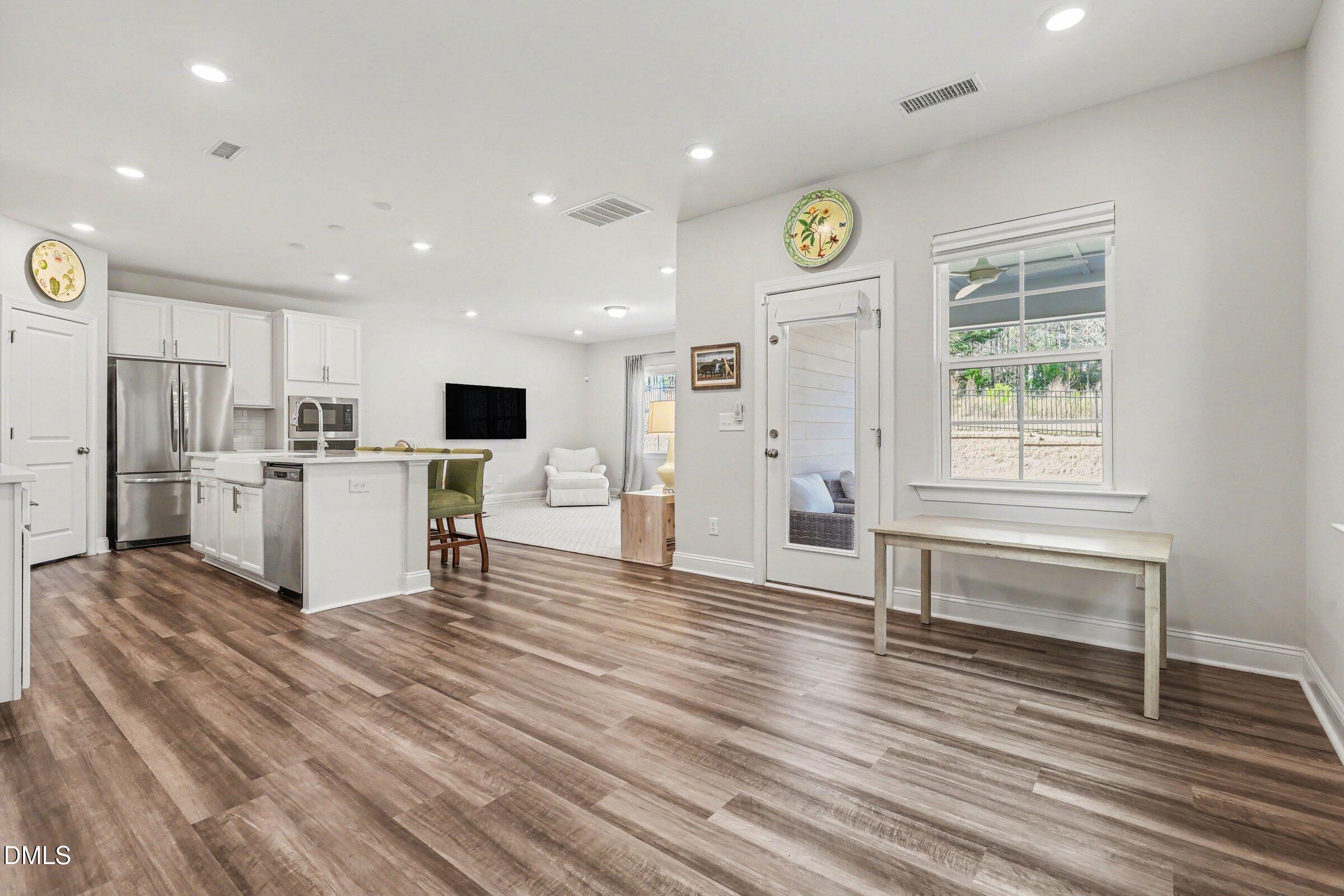 4921 Abundance Avenue Raleigh, NC 27616 - Photo 14 of 36 a view of kitchen with wooden floor and electronic appliances
