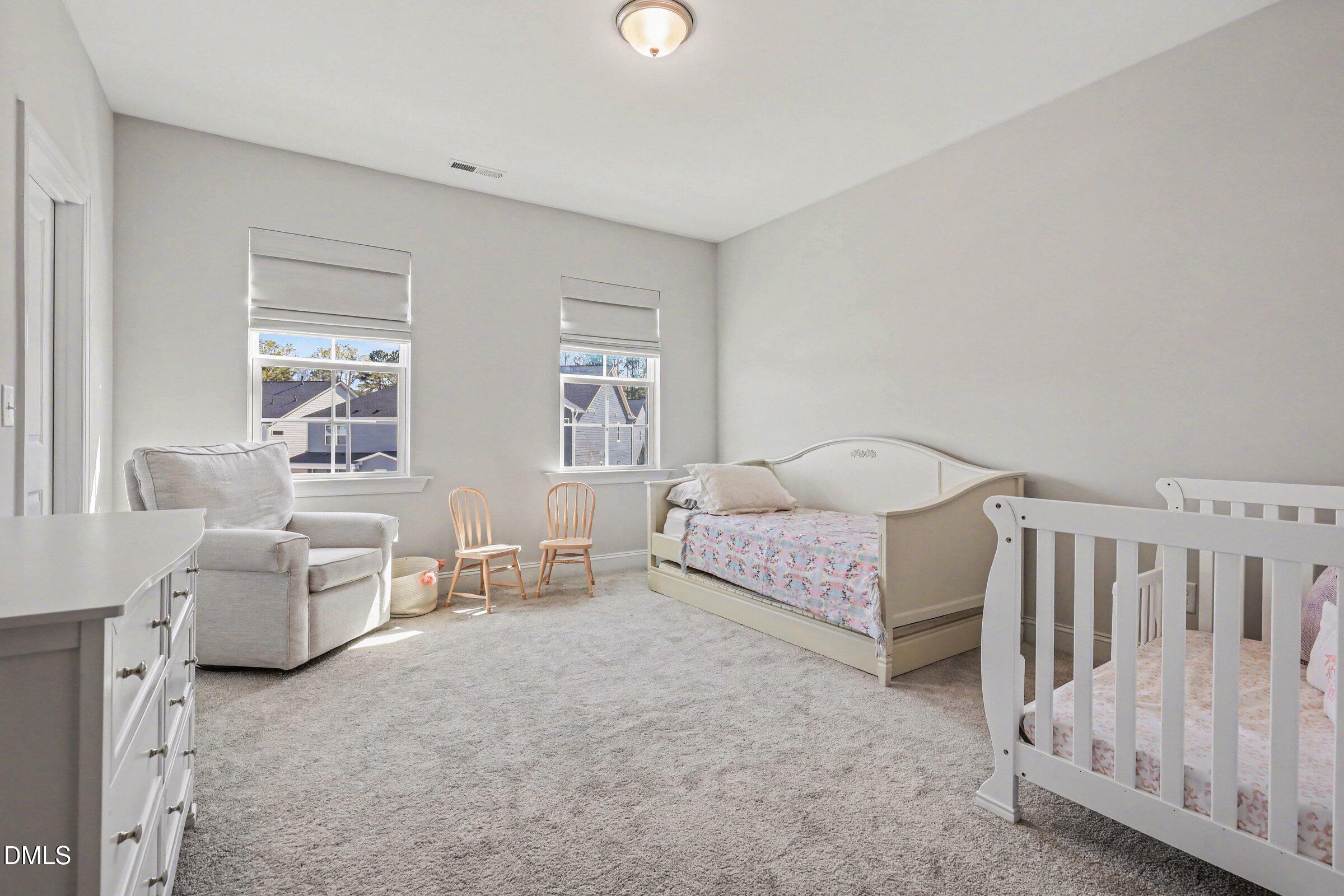 4921 Abundance Avenue Raleigh, NC 27616 - Photo 27 of 36 a bed room with furniture and a window