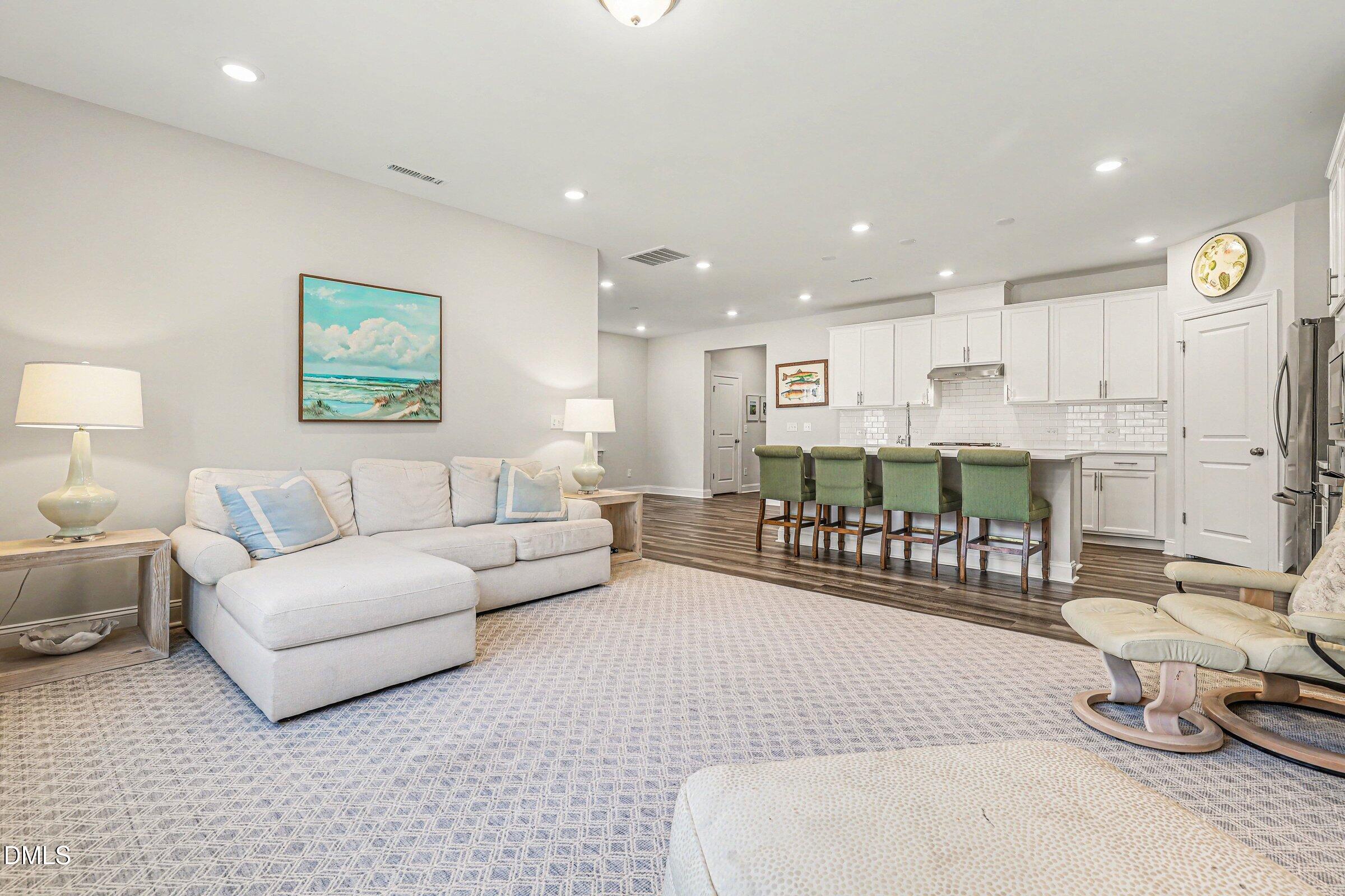 4921 Abundance Avenue Raleigh, NC 27616 - Photo 9 of 36 a living room with furniture and a table