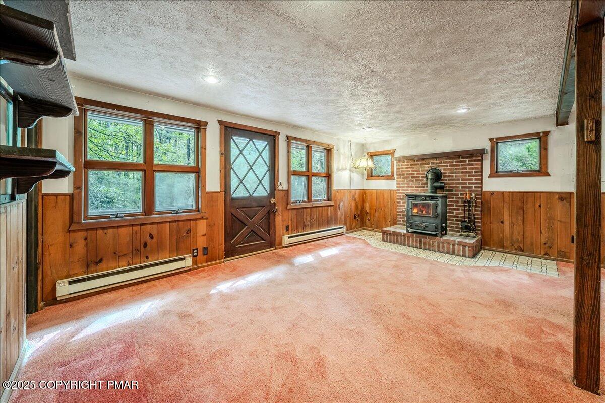 115 Dirk Road Tafton, PA 18464 - Photo 3 of 24 a living room with furniture and a flat screen tv