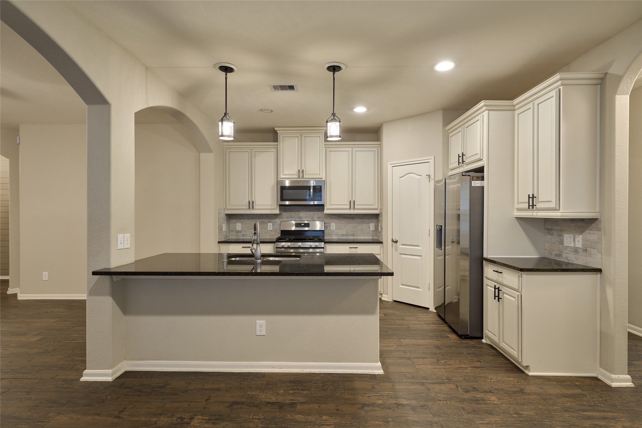 116 Fox Trail Road Montgomery, TX 77316 - Photo 18 of 50 The open layout features pendant lighting, and a spacious island-perfect for cooking and entertaining.