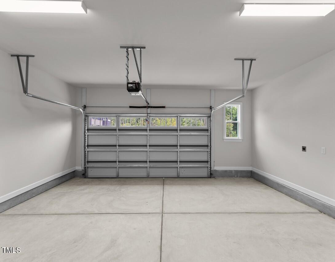 4822 Cypress Tree Lane, Unit 1 Raleigh, NC 27612 - Photo 25 of 33 Two care garage with storage