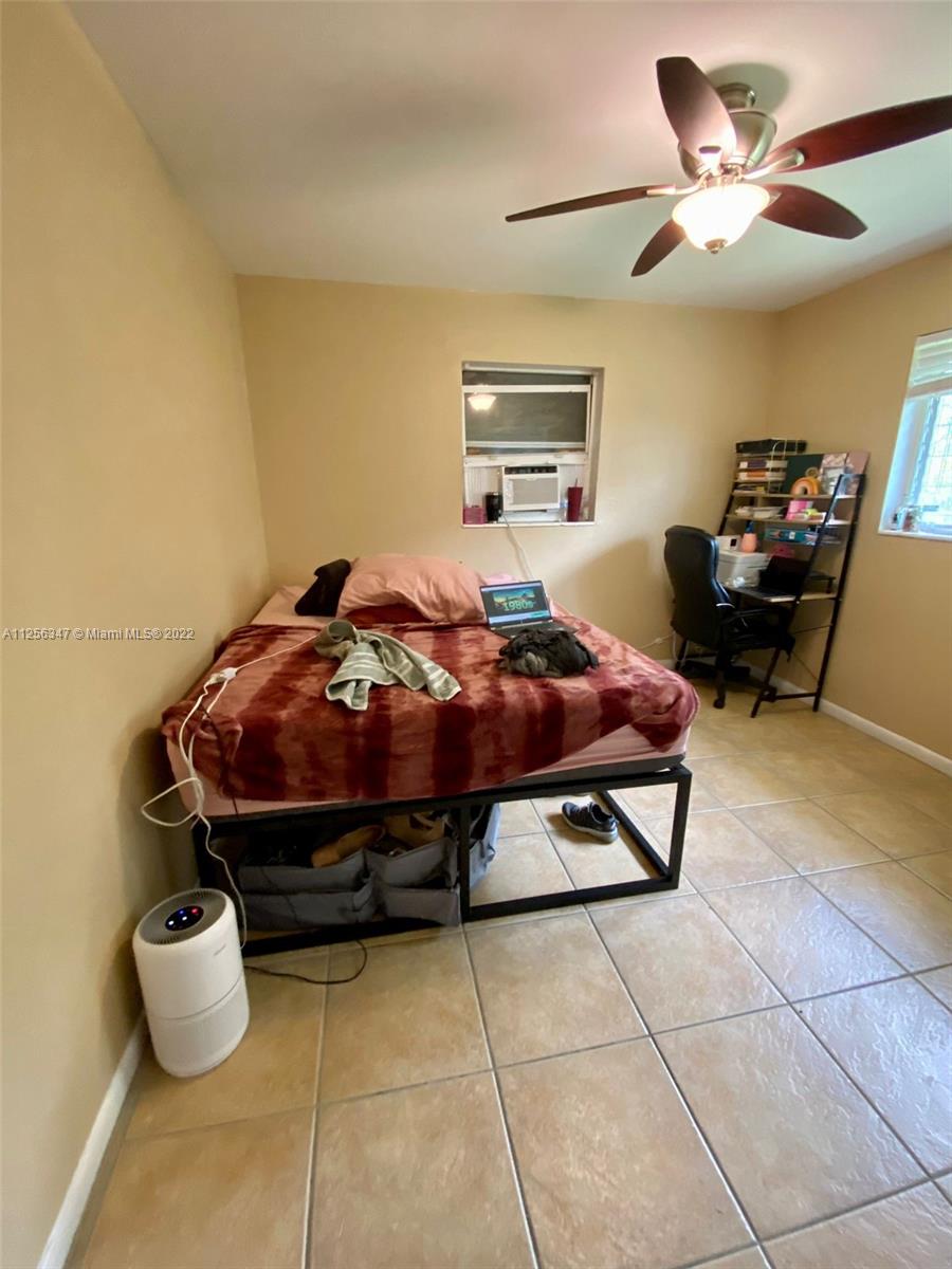 1305 Drexel Road West Palm Beach, FL 33417 - Photo 11 of 20 a bedroom with furniture and a window