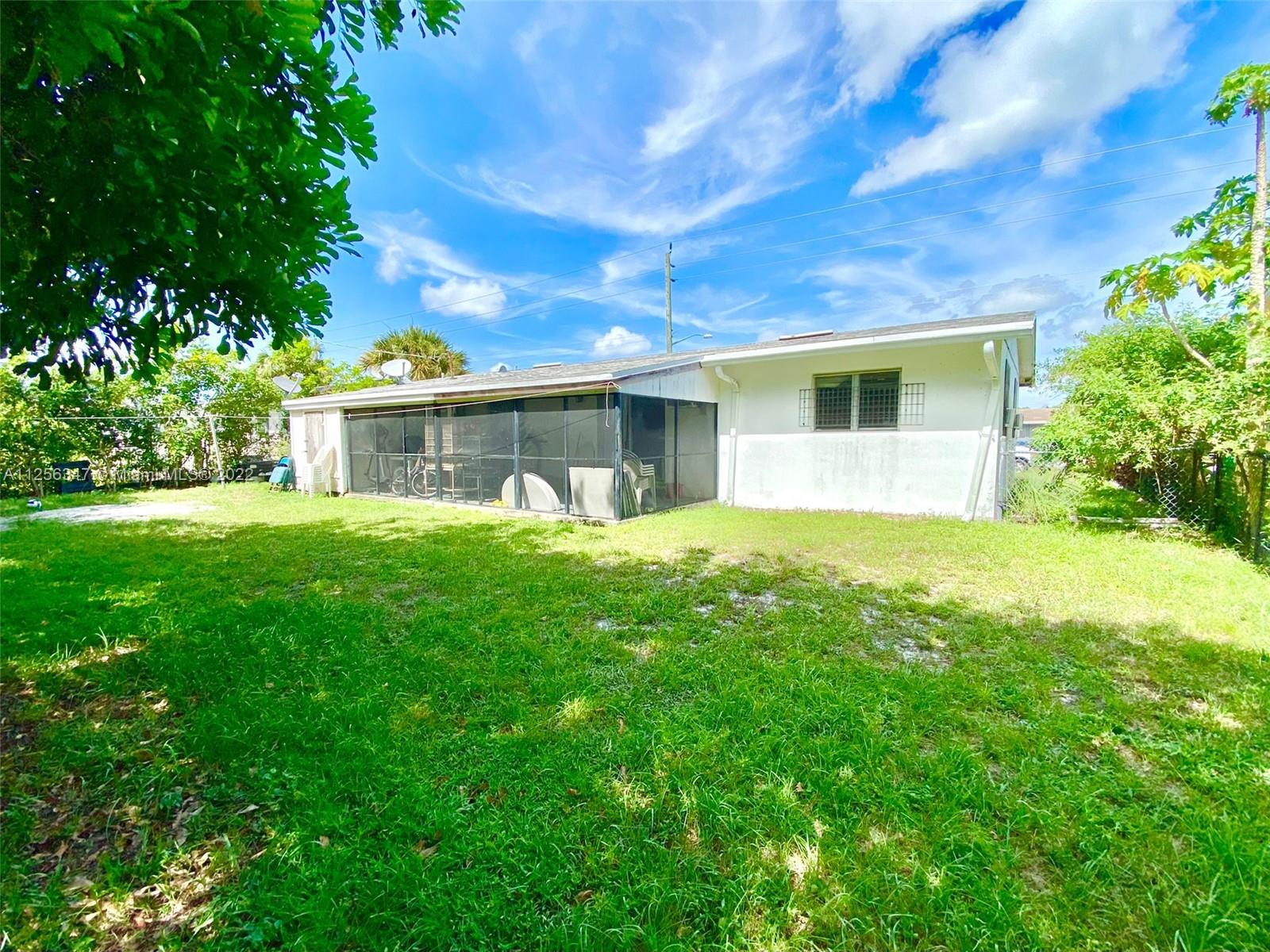 1305 Drexel Road West Palm Beach, FL 33417 - Photo 16 of 20 a view of a house with a yard