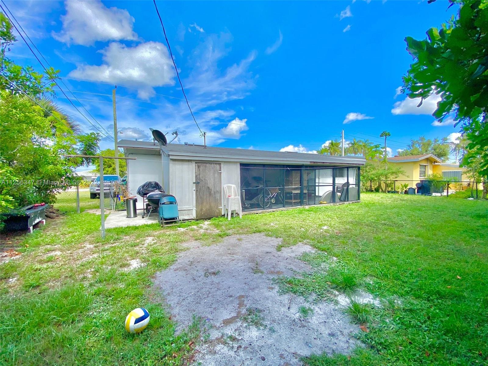 1305 Drexel Road West Palm Beach, FL 33417 - Photo 17 of 20 a front view of a house with garden
