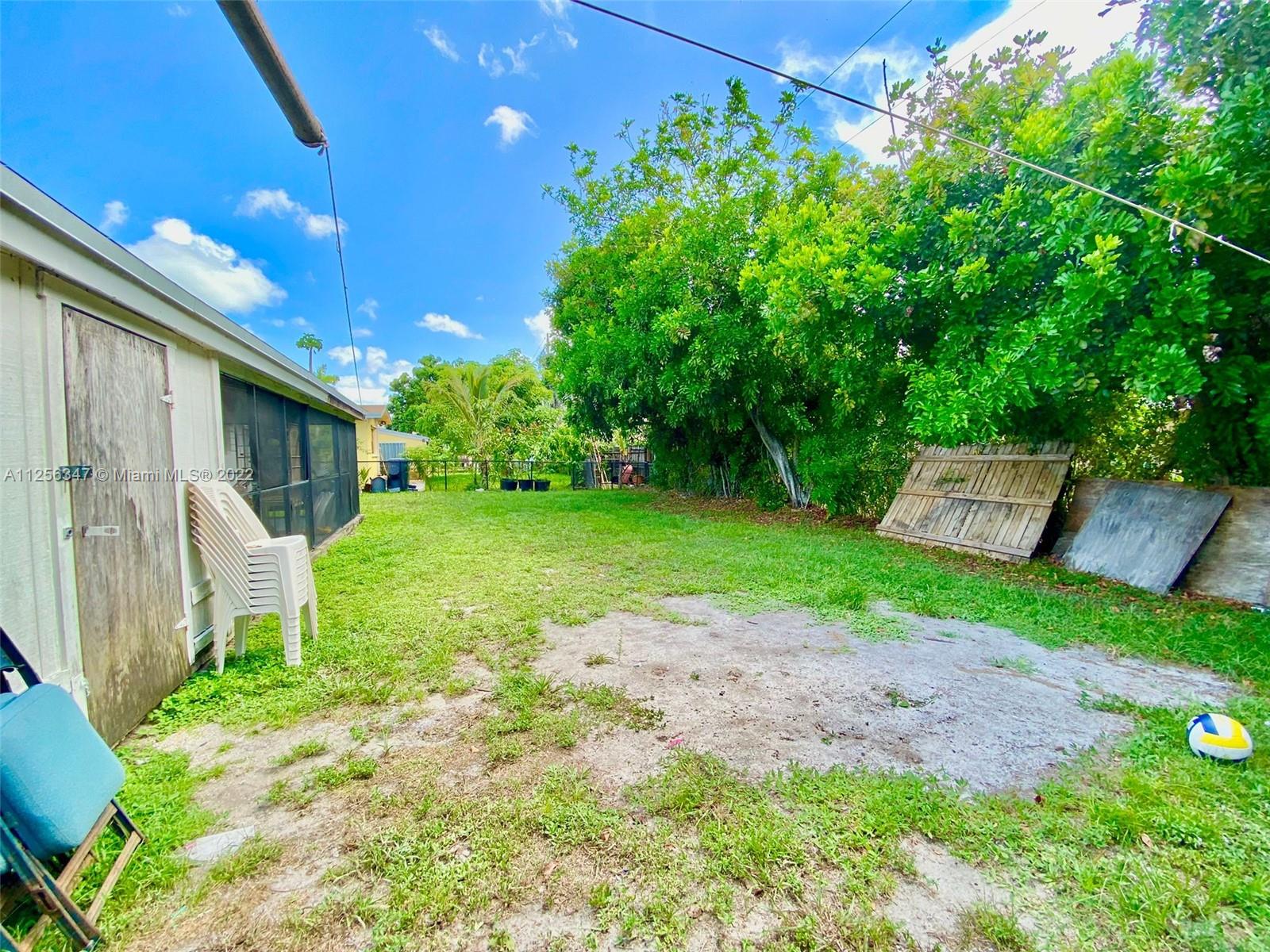 1305 Drexel Road West Palm Beach, FL 33417 - Photo 18 of 20 a view of a back yard with green space