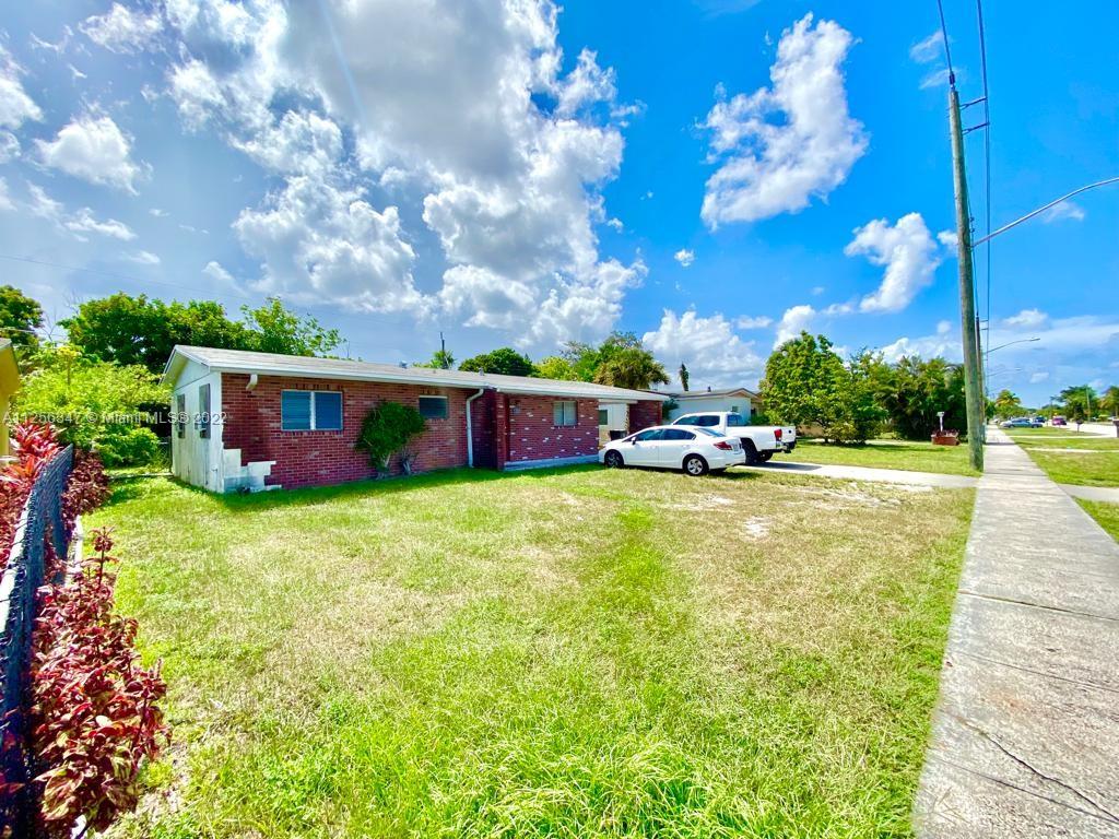 1305 Drexel Road West Palm Beach, FL 33417 - Photo 2 of 20 a swimming pool with outdoor seating and yard