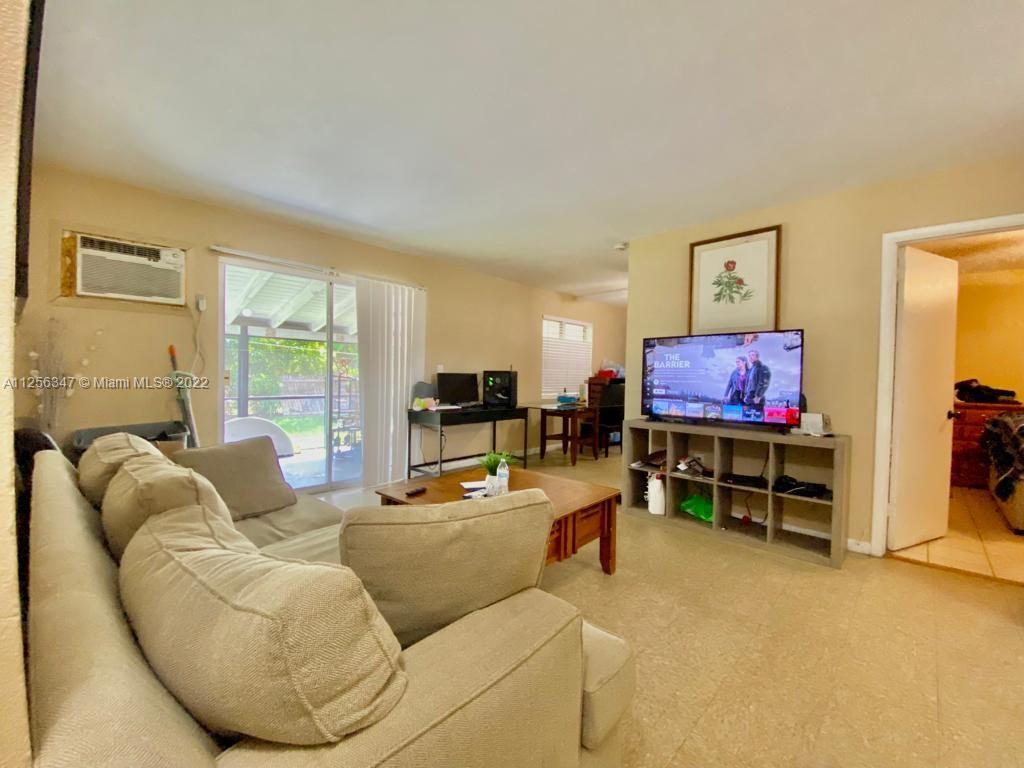 1305 Drexel Road West Palm Beach, FL 33417 - Photo 5 of 20 a living room with furniture and a flat screen tv
