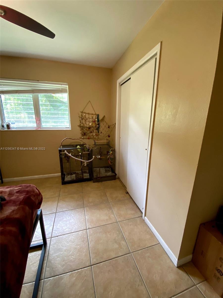1305 Drexel Road West Palm Beach, FL 33417 - Photo 9 of 20 a living room with furniture and a window