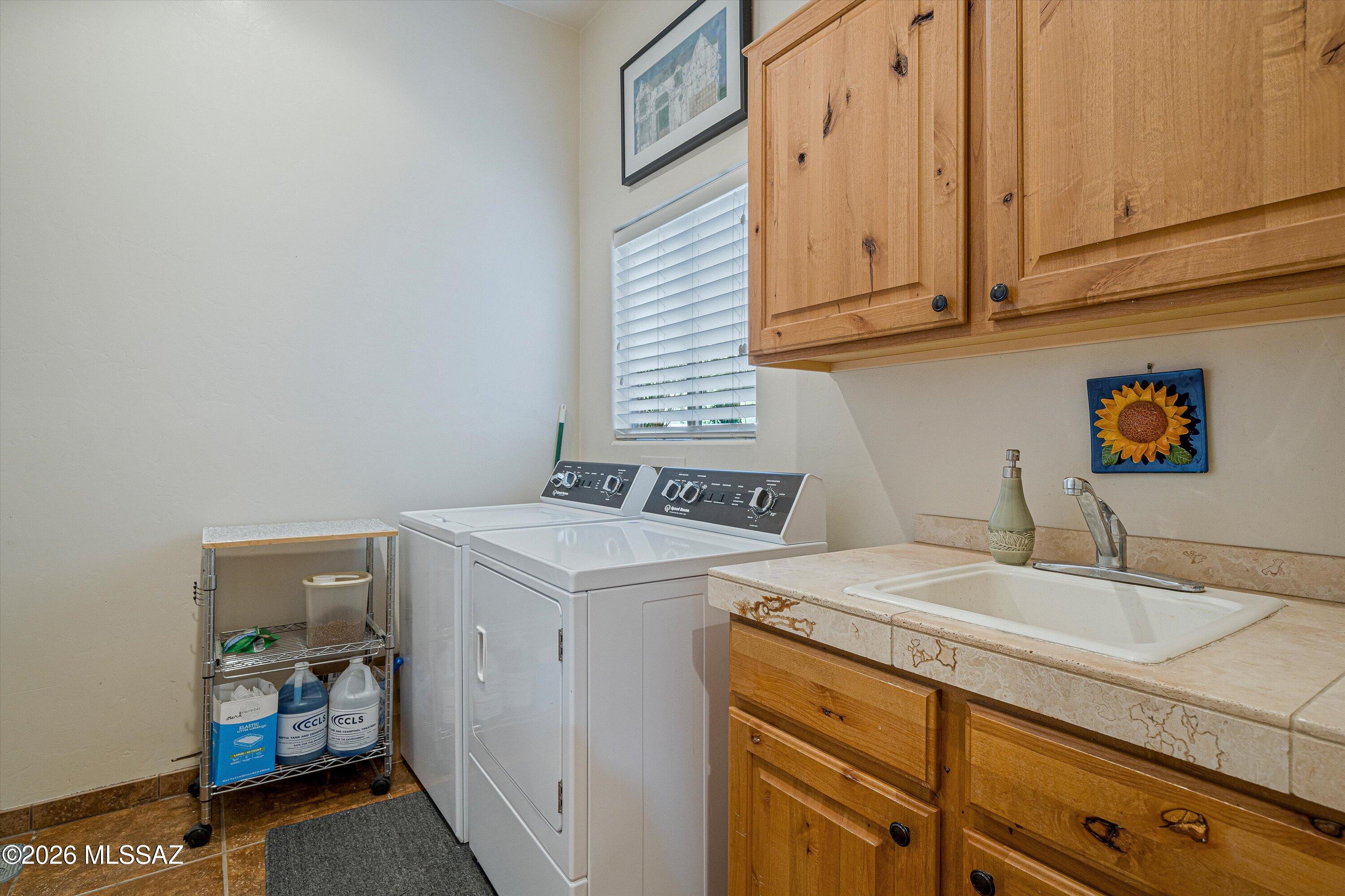 4677 East Rail N Road Tucson, AZ 85739 - Photo 33 of 48 Dedicated laundry room between 3 car garage, off the kitchen and great room