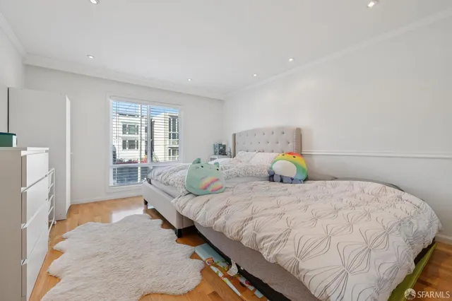 a bedroom with a bed and lamps