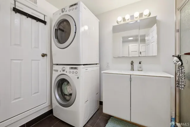 a bathroom with a shower sink and mirror